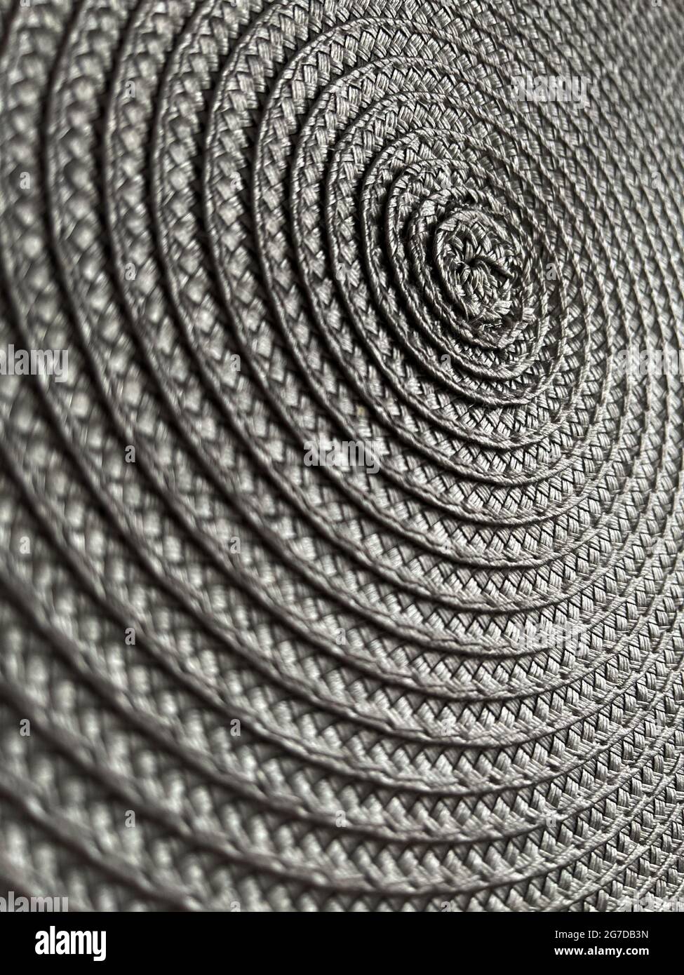 Sfondo da texture di motivo vimini circolari. Tessitura grigia. Foto Stock