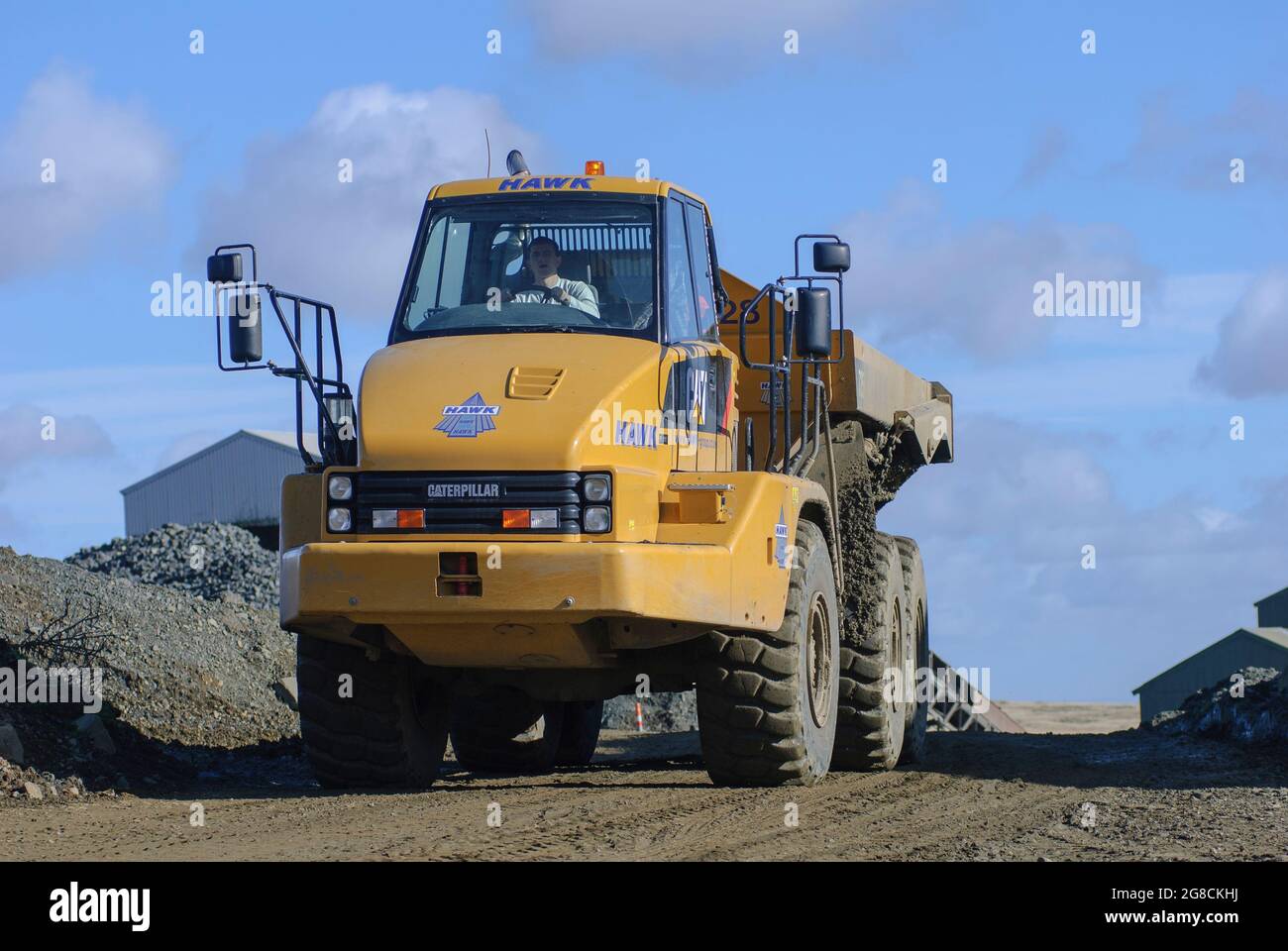 Dumper articolato Caterpillar 725 in cava in Inghilterra. Foto Stock