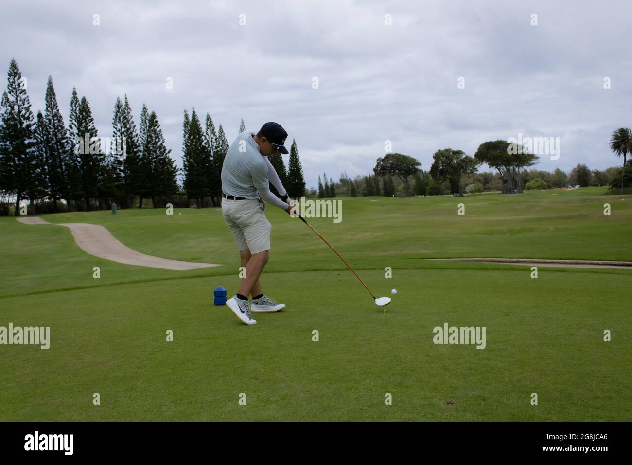 Cattura di un giocatore di golf nella loro oscillazione Foto Stock