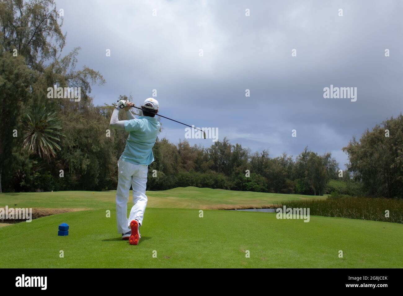 Cattura di un giocatore di golf nella loro oscillazione Foto Stock