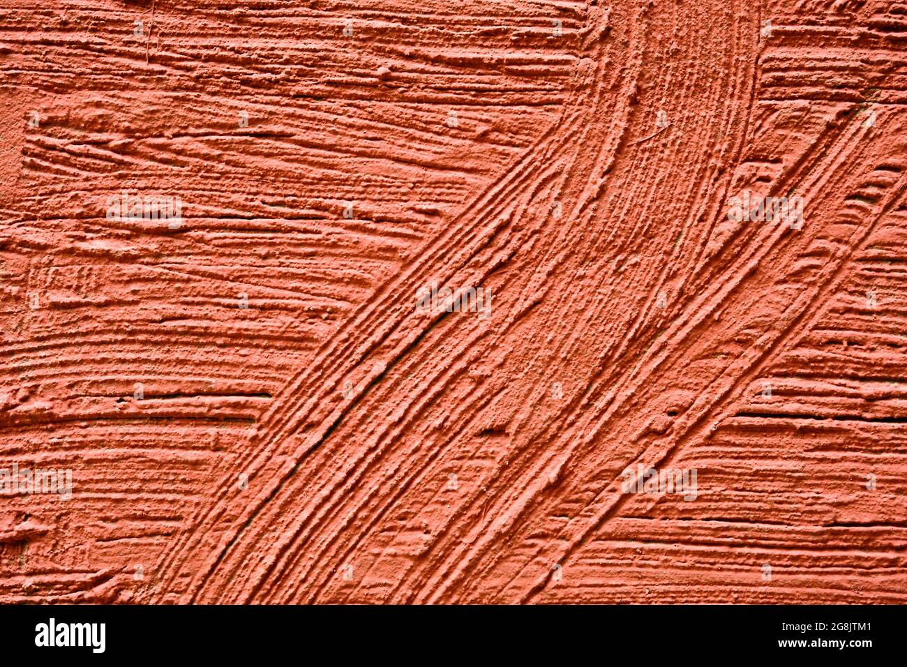 Parete esterna in gesso rosso con struttura granulosa Foto Stock