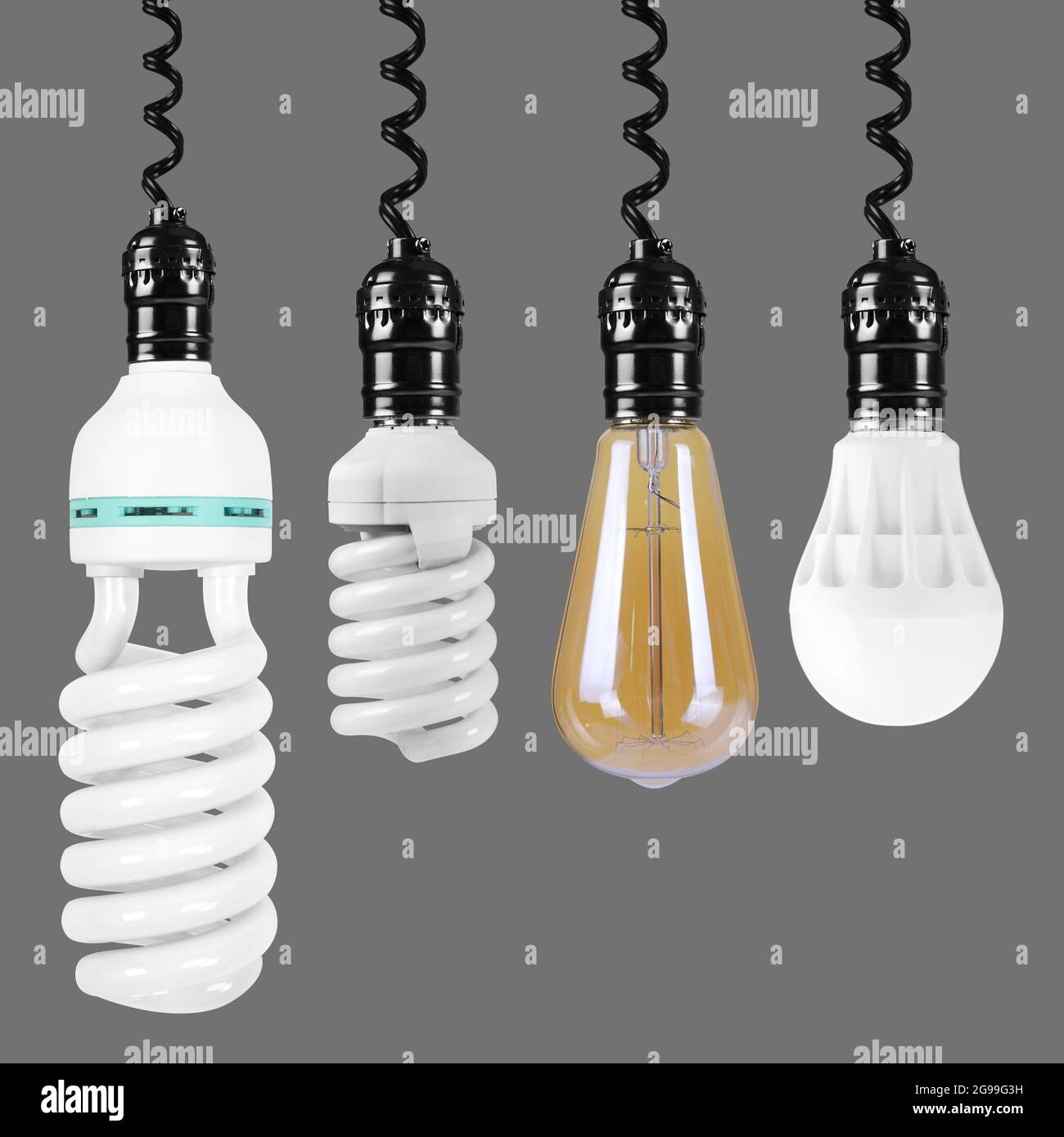 Rete elettrica - consente di impostare le lampadine a LED e a incandescenza a risparmio energetico su uno sfondo grigio. E 'isolato, il lavoratore dei percorsi è pr Foto Stock