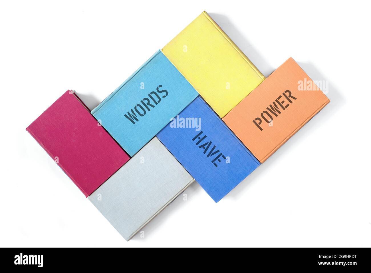 Libri e parole slogan hanno potere, istruzione, lettura, apprendimento, ritorno a scuola concetto, isolato su bianco Foto Stock