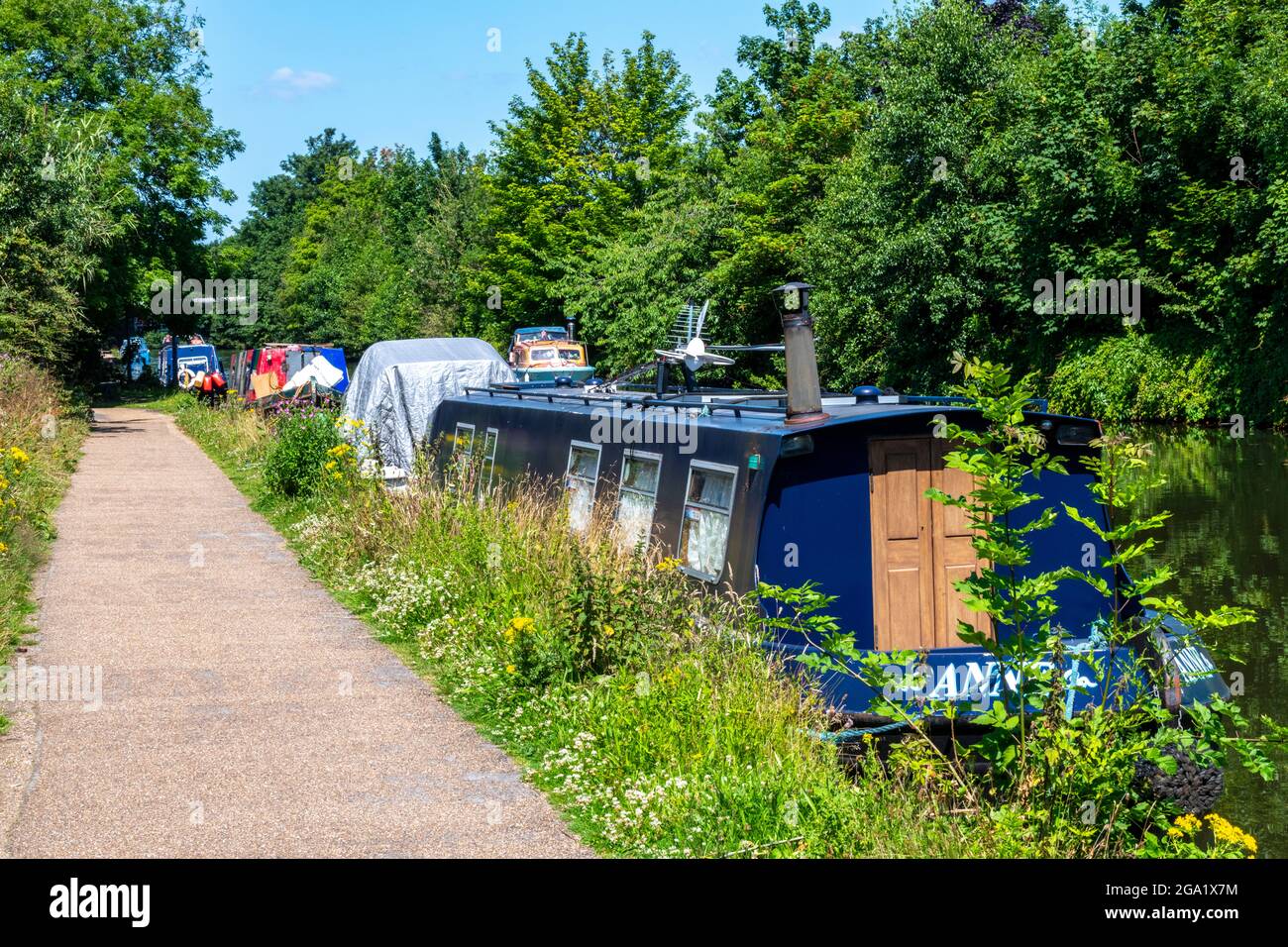 barche del canale chiatte e barche a chiodata ormeggiate sul canale bridgewater alzaia vicino vendita in greater manchester uk. Foto Stock