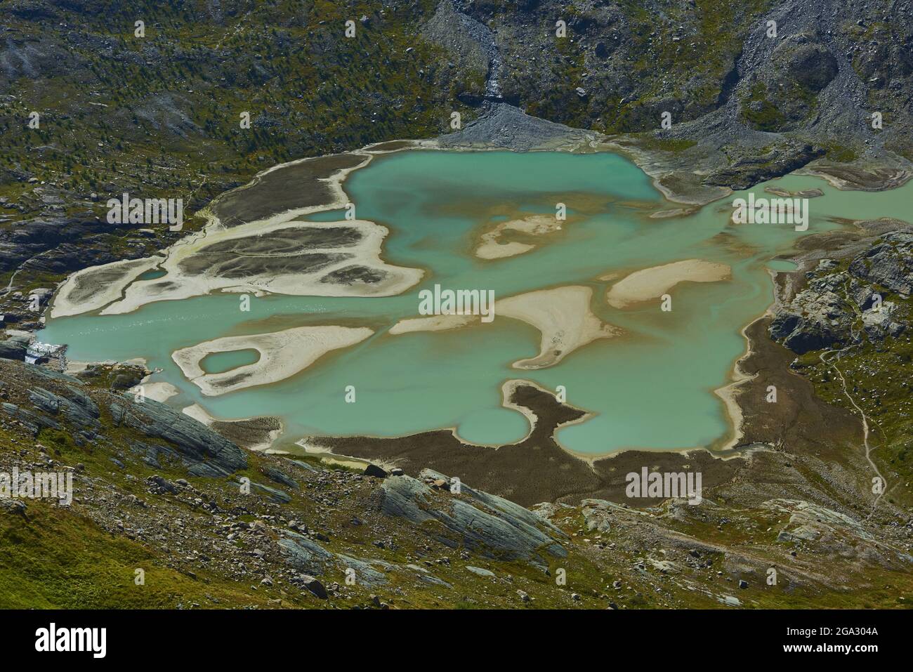 Lago di Ghiacciaio Pasterze da Gamsgrubenweg con le sue acque turchesi, fangose e la massa glaciale circostante, Franz-Joseph-Höhe al mattino presto Foto Stock