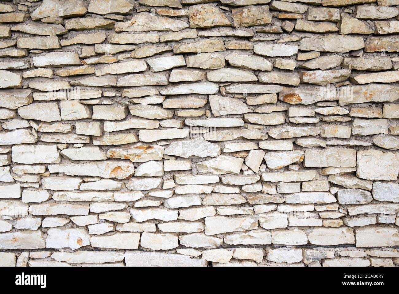 Muro di pietra uno sfondo o una trama Foto Stock