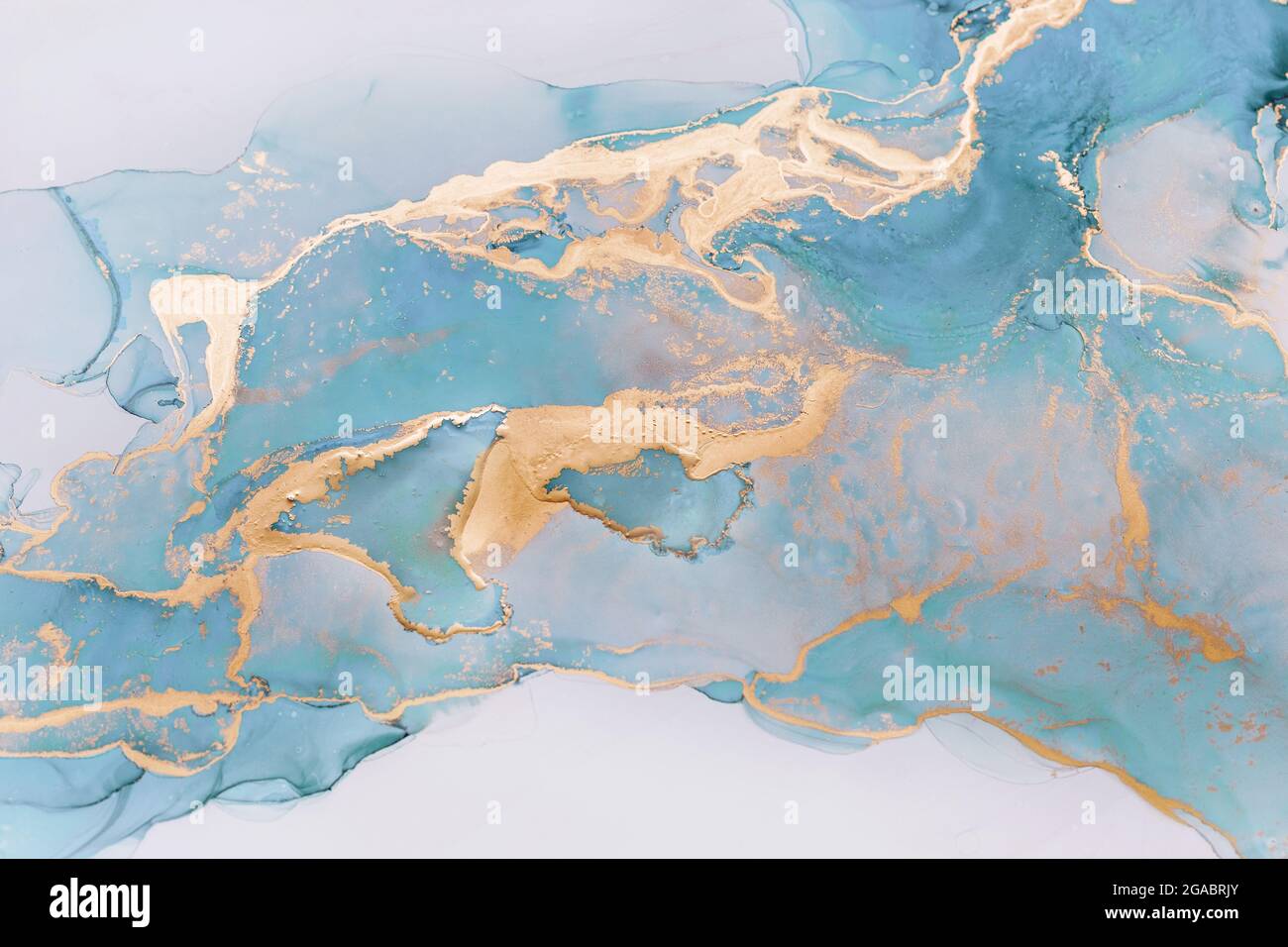 Inchiostro liquido astratto pittura sfondo in colori pastello con spruzzi d'oro Foto Stock