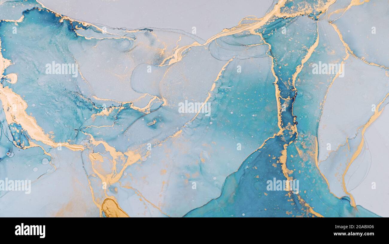 Inchiostro liquido astratto pittura sfondo in colori pastello con spruzzi d'oro Foto Stock