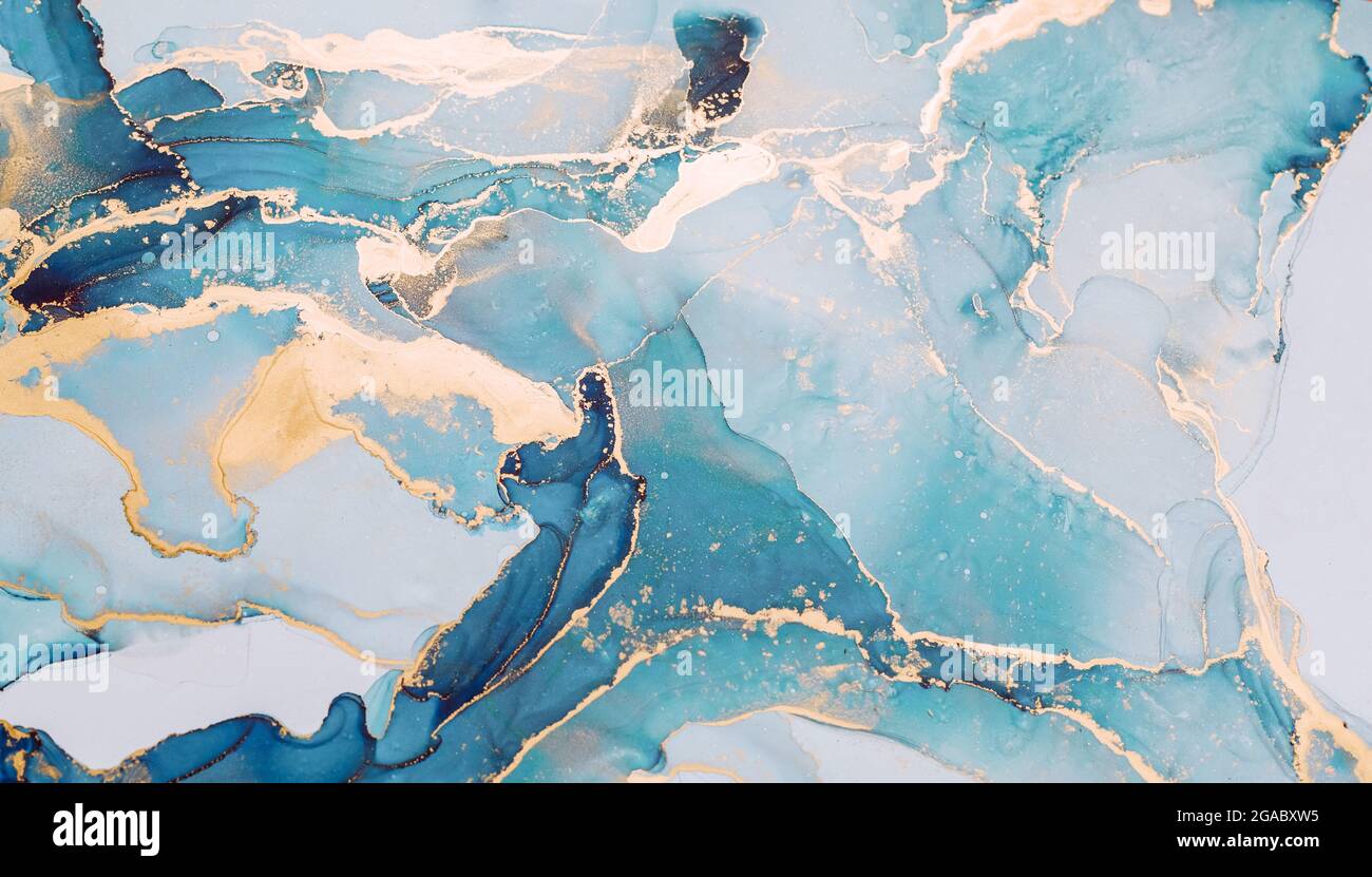 Inchiostro liquido astratto pittura sfondo in colori pastello con spruzzi d'oro Foto Stock