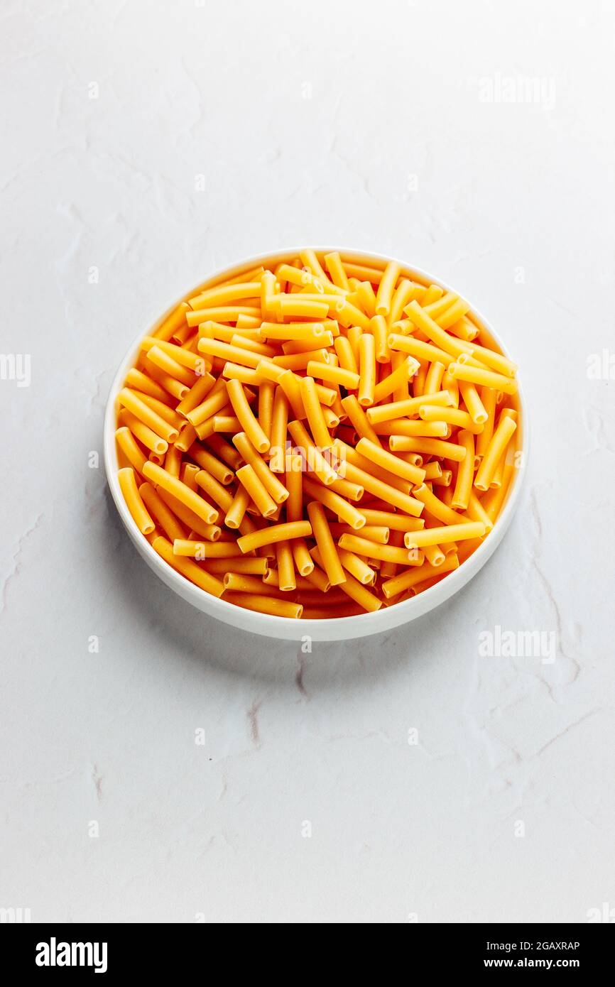 Macaroni Pasta Raw on a White background, Isolated – FOODPIX WHITE - COPYSPACE - SPAZIO PER IL TESTO Foto Stock