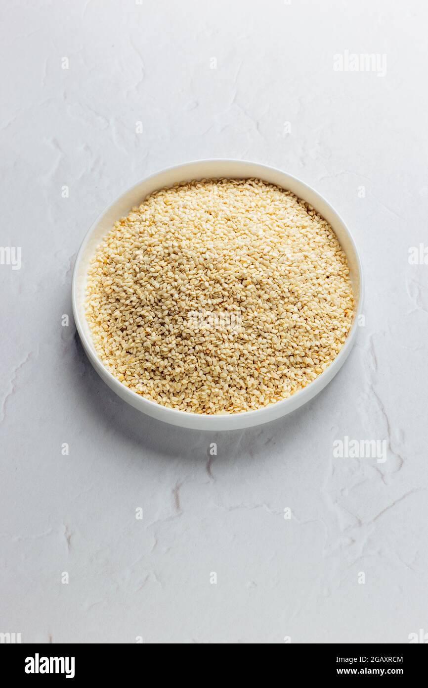 Taperioca Grains on a White Dish on a White background, Isolated – FOODPIX WHITE - COPYSPACE - SPAZIO PER IL TESTO Foto Stock