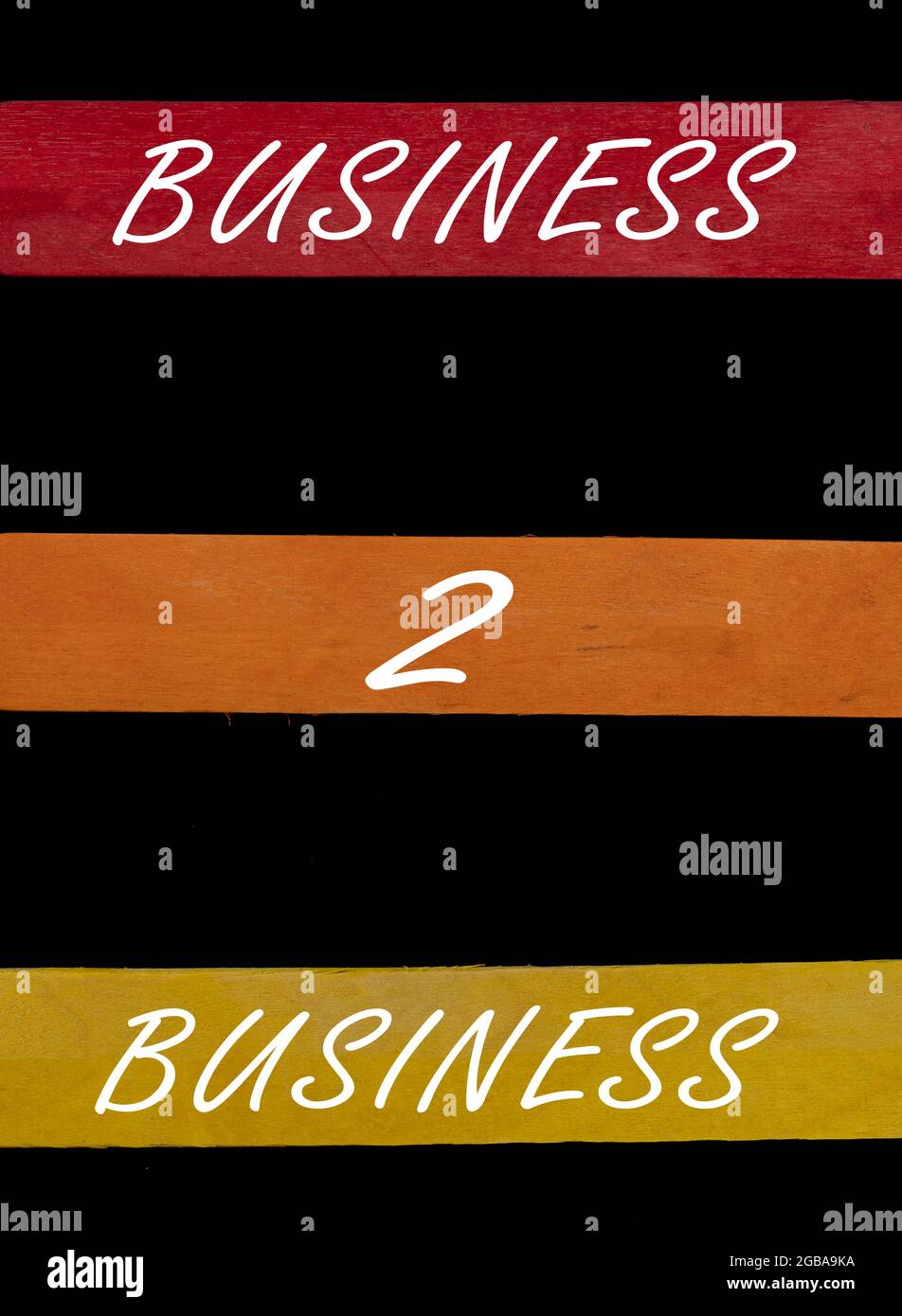 Business 2 testo aziendale su bastoni colorati disposti dall'alto verso il basso su sfondo nero Foto Stock