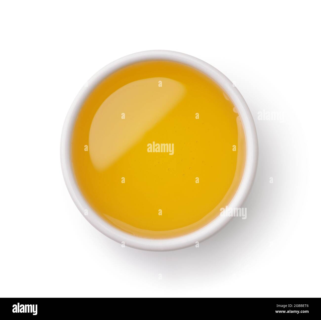 Ciotola in ceramica di miele isolata su bianco, vista dall'alto Foto Stock