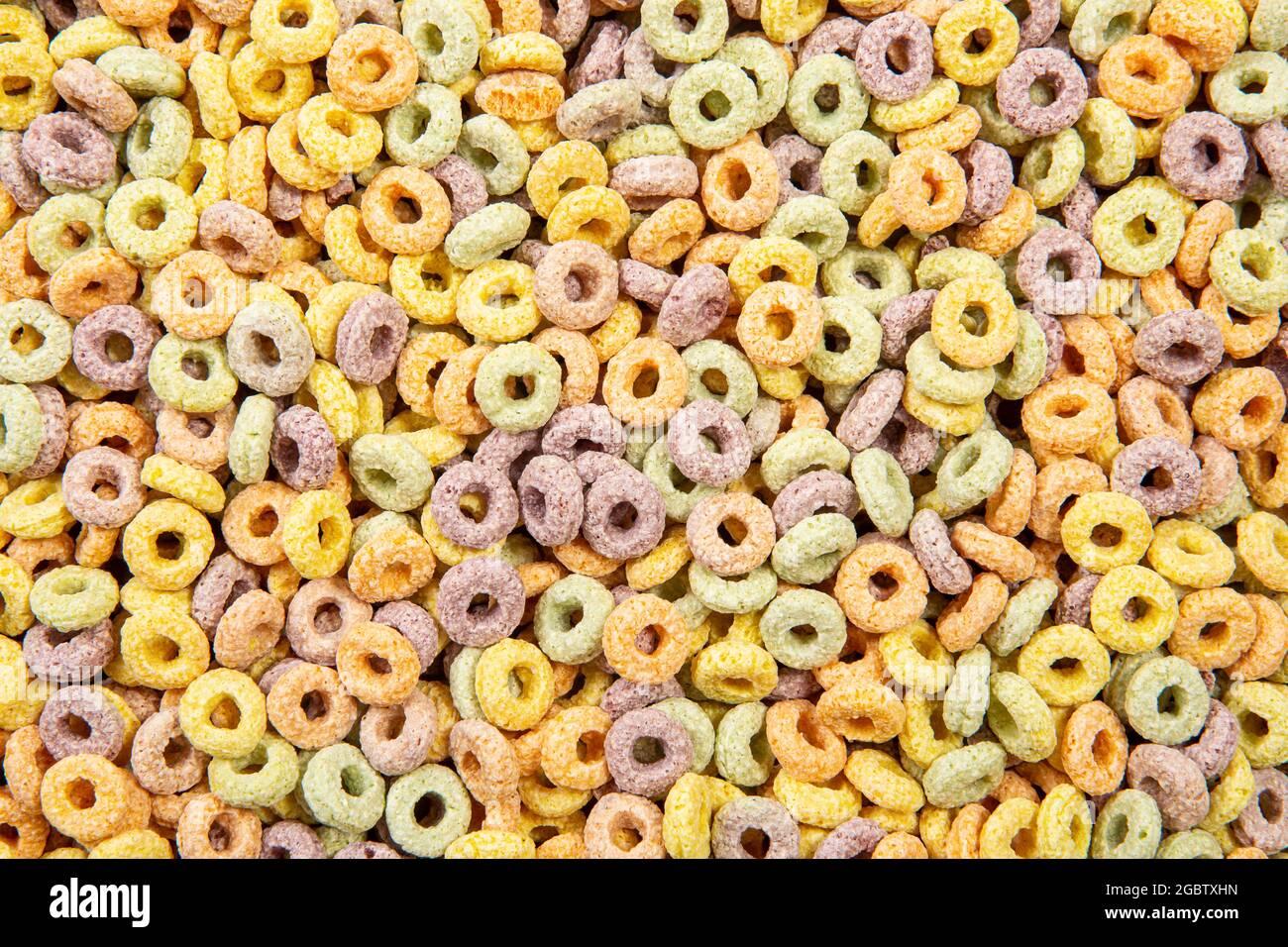 Colazione multicolore con cereali di sottofondo. Foto Stock