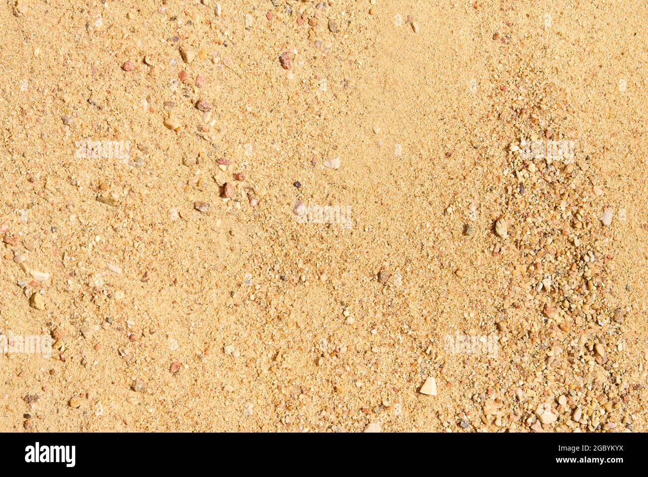 Fiume sabbia rocciosa in sole giorno macro closeup sfondo sabbioso per calcestruzzo mix nel settore delle costruzioni. Foto Stock