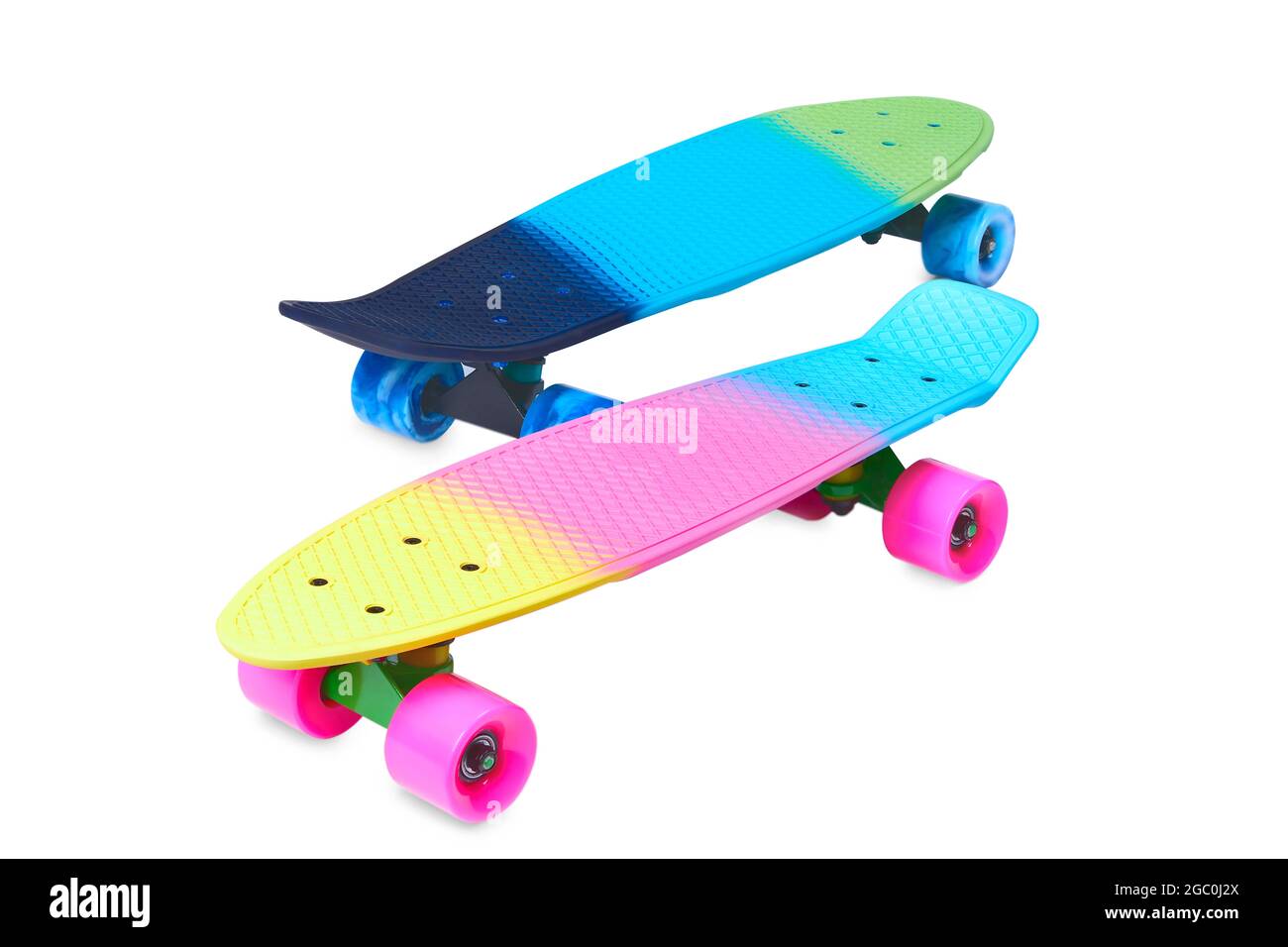 Due skateboard in plastica Rainbow Penny su sfondo bianco Foto Stock