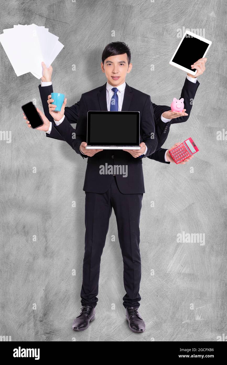 Concetto di multitasking.businessman con molti hands.efficient lavoratore di affari. Foto Stock