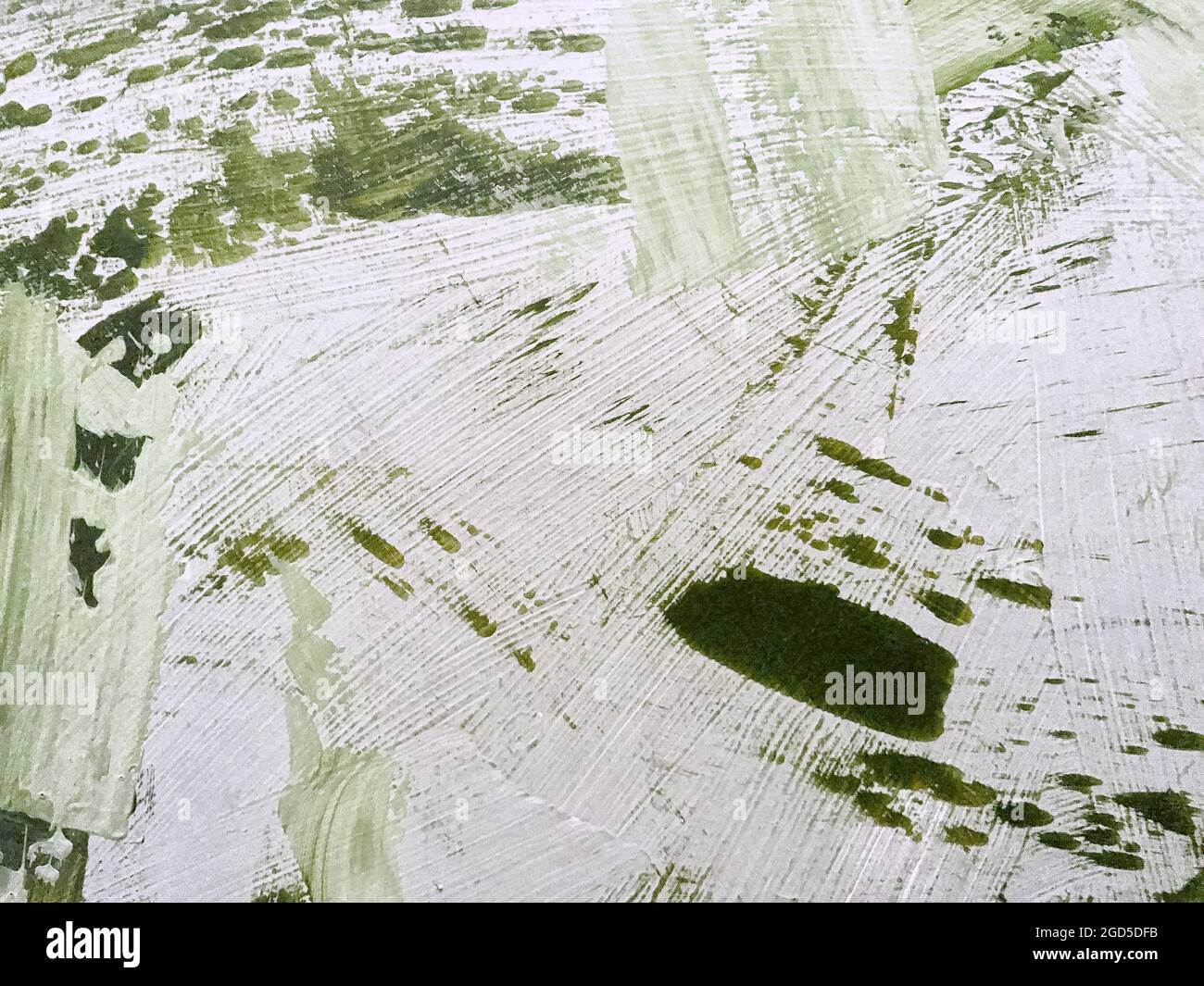 Astratto arte sfondo verde chiaro e bianco colori. Pittura acquerello su tela con sfumatura di oliva. Sfondo in tessuto acrilico con pattina di spruzzi Foto Stock