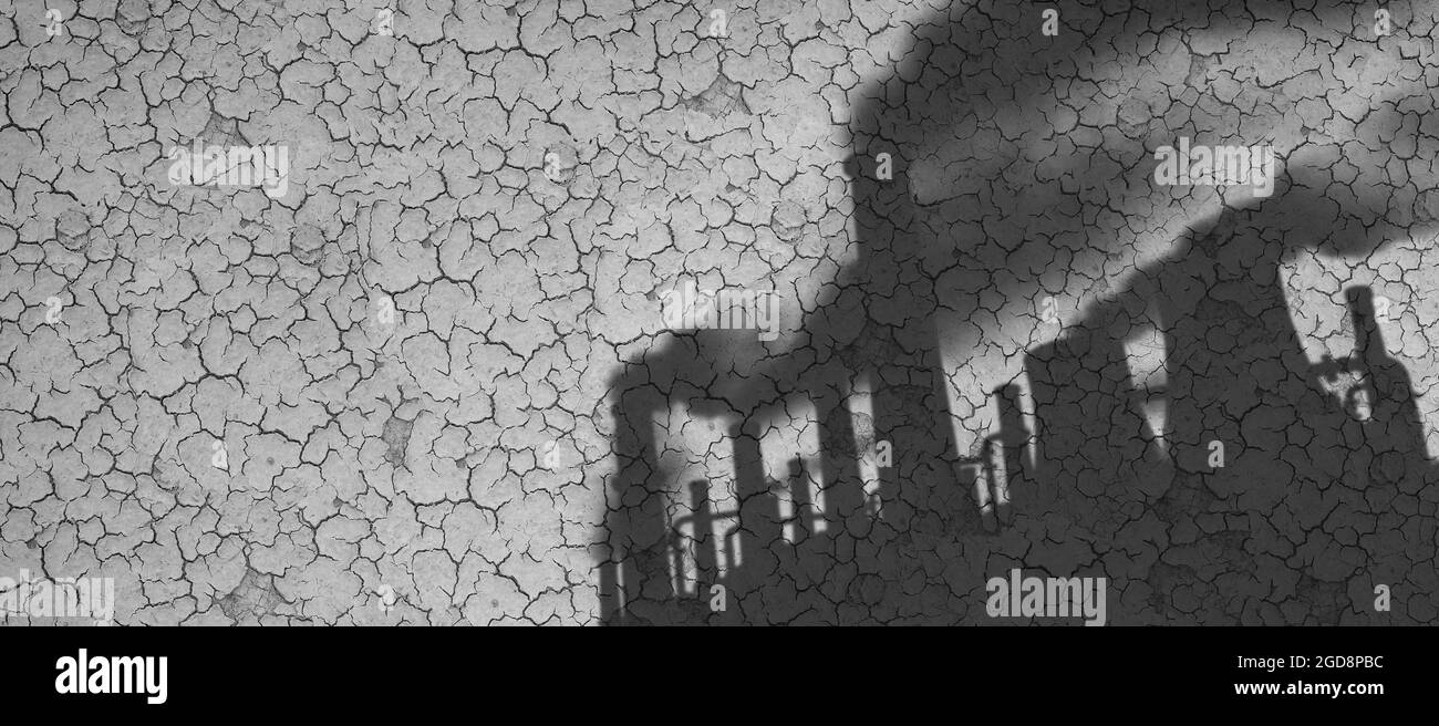I cambiamenti climatici provocati dall'uomo e i gas a effetto serra come ombra di fonti di inquinamento industriale su terreni secchi o crackizzati e affetti da calore dovuto alla siccità. Foto Stock