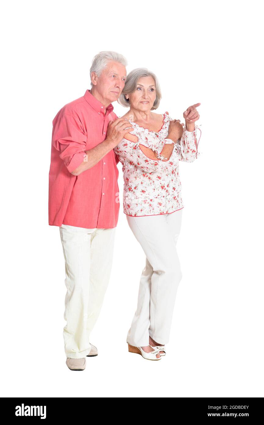 Ritratto di una coppia anziana carina che indica Foto Stock