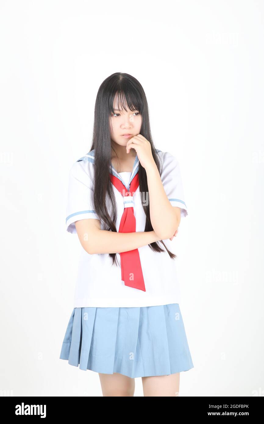 scuola asiatica ragazza isolato in bianco sfondo Foto Stock
