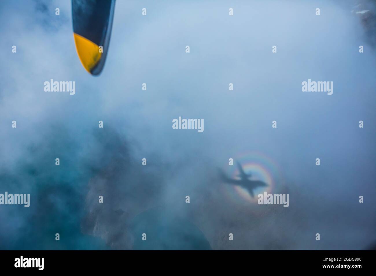abstract view of airplane shadow in a rainbow ring Foto Stock