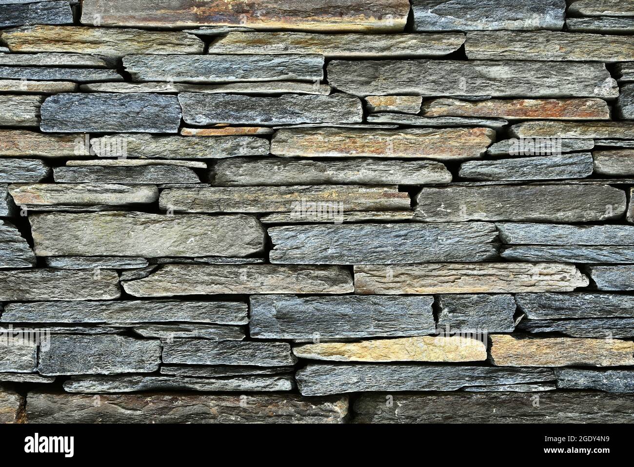 Dettaglio di un muro di pietra. Foto Stock