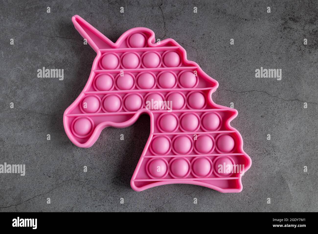 Pop it anti-stress giocattolo sensoriale per bambini e adulti Foto Stock