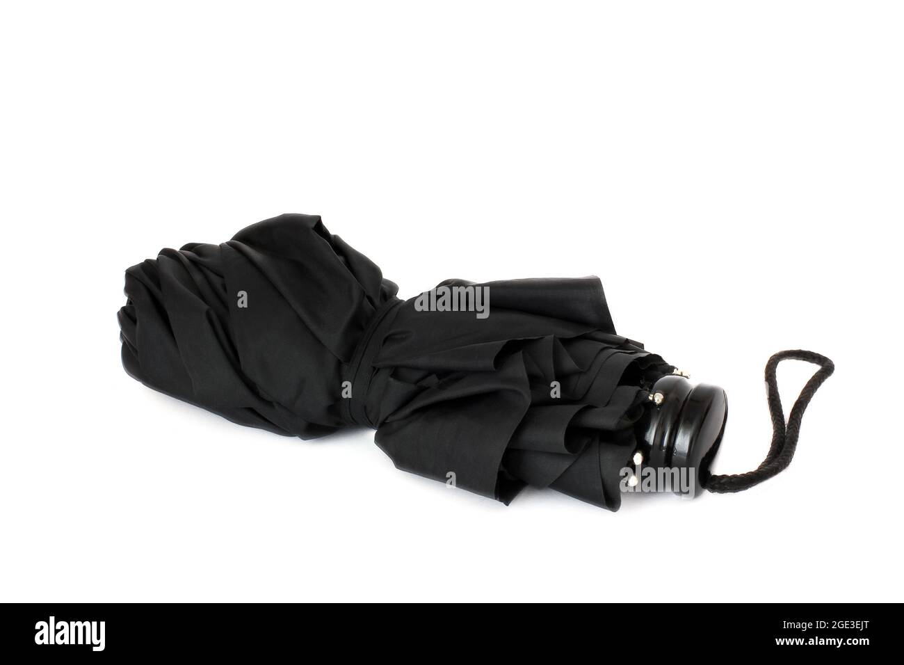 Ombrello nero su sfondo bianco Foto Stock
