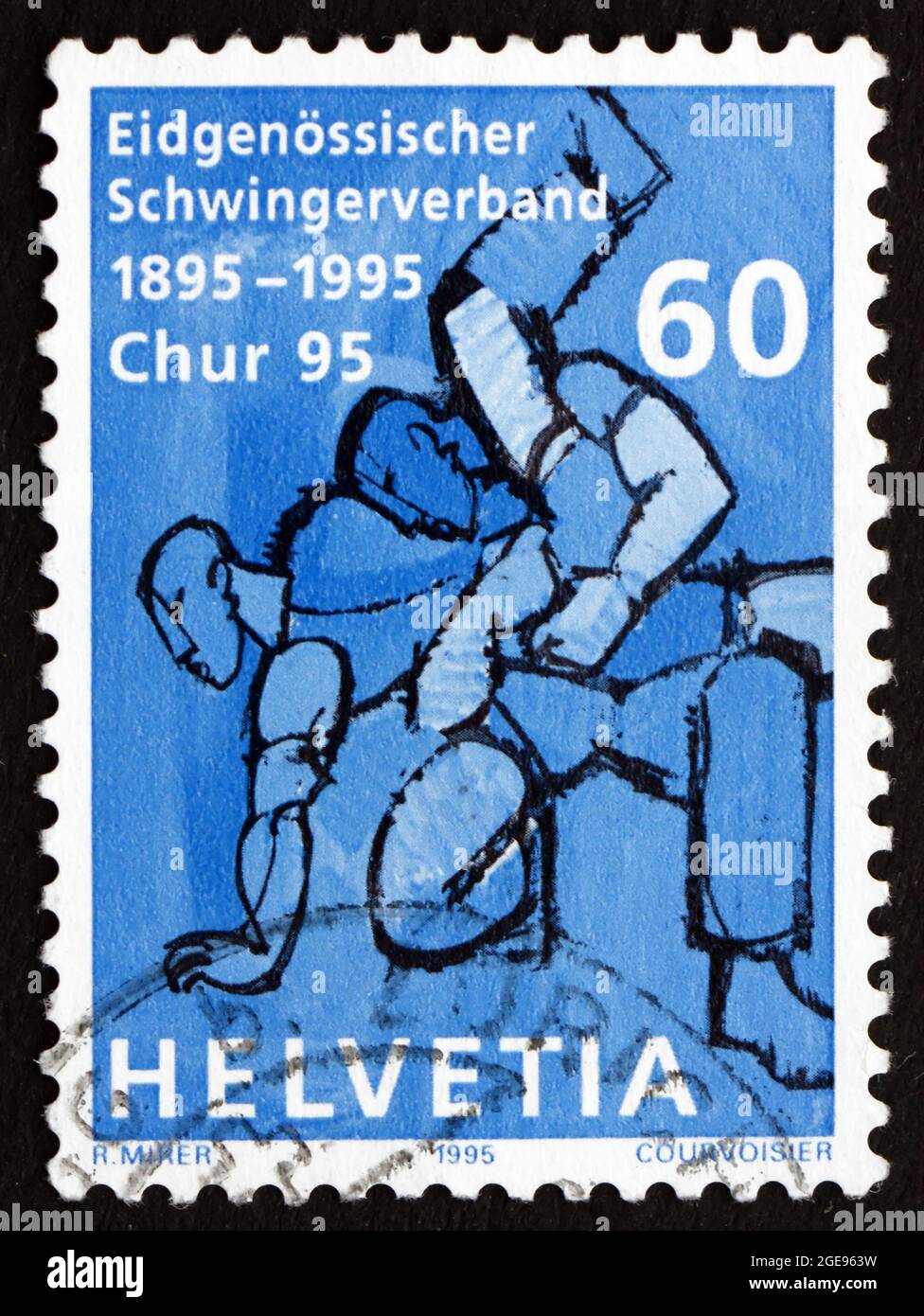 SVIZZERA - CIRCA 1995: Un francobollo stampato in Svizzera mostra wrestler, Centenario della Swiss Wrestling Association, circa 1995 Foto Stock