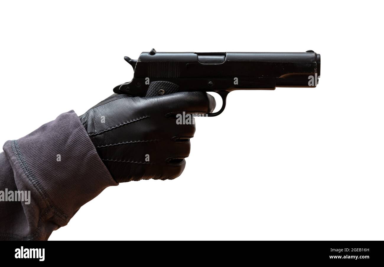 Pistola in mano guanto. Gunman indossando guanti in pelle con una pistola  isolata su sfondo bianco, vista closeup. Concetto killer, assassino Foto  stock - Alamy