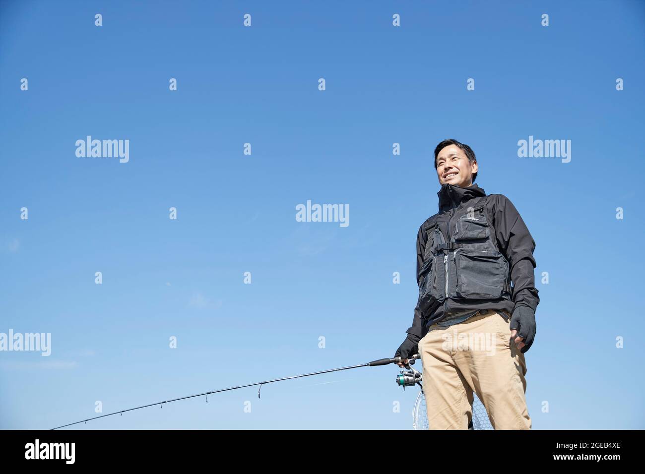 Giapponese uomo pesca Foto Stock