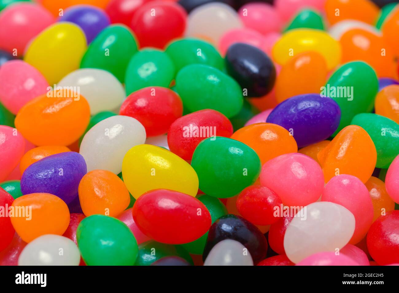 Pila di colorful Jelly Bean Candy sfondo Texture. Foto Stock