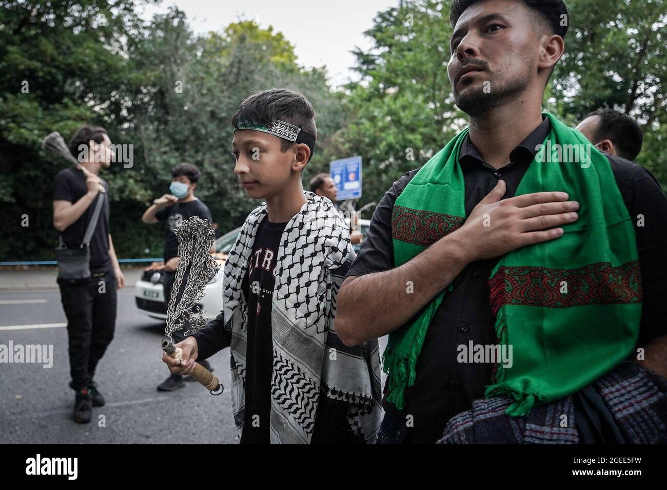 Centinaia di musulmani sciiti partecipano all'annuale Ashura Day Procession. Hyde Park, Londra, Regno Unito. Foto Stock