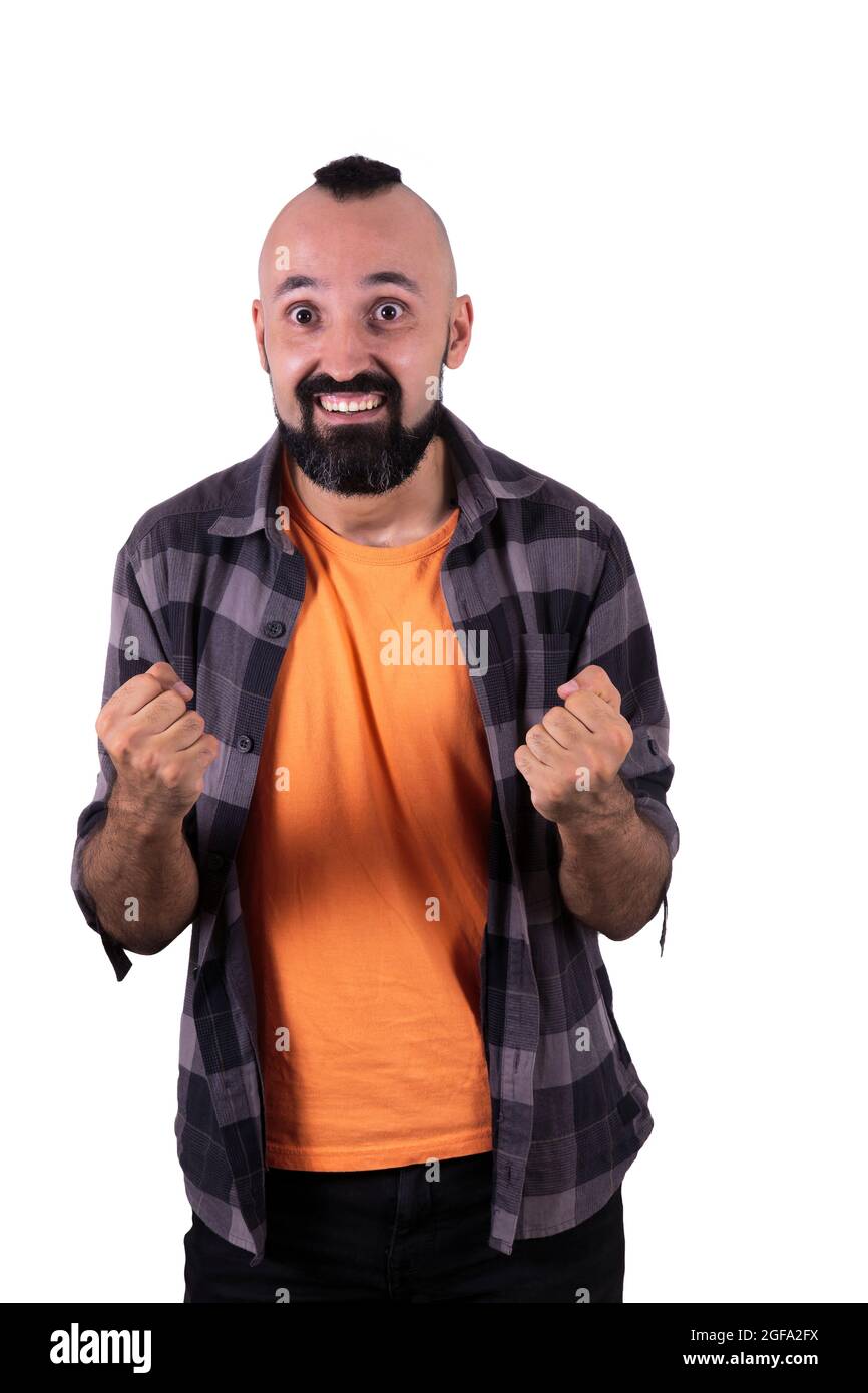 Il giovane eccitato che guarda la macchina fotografica Foto Stock