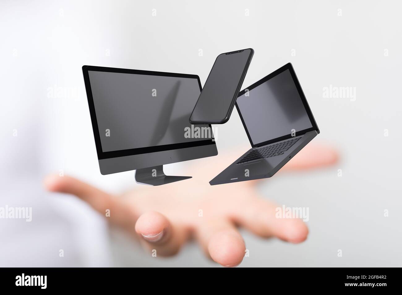 Tenere la mano rende di un telefono cellulare, uno schermo, e un computer portatile Foto Stock