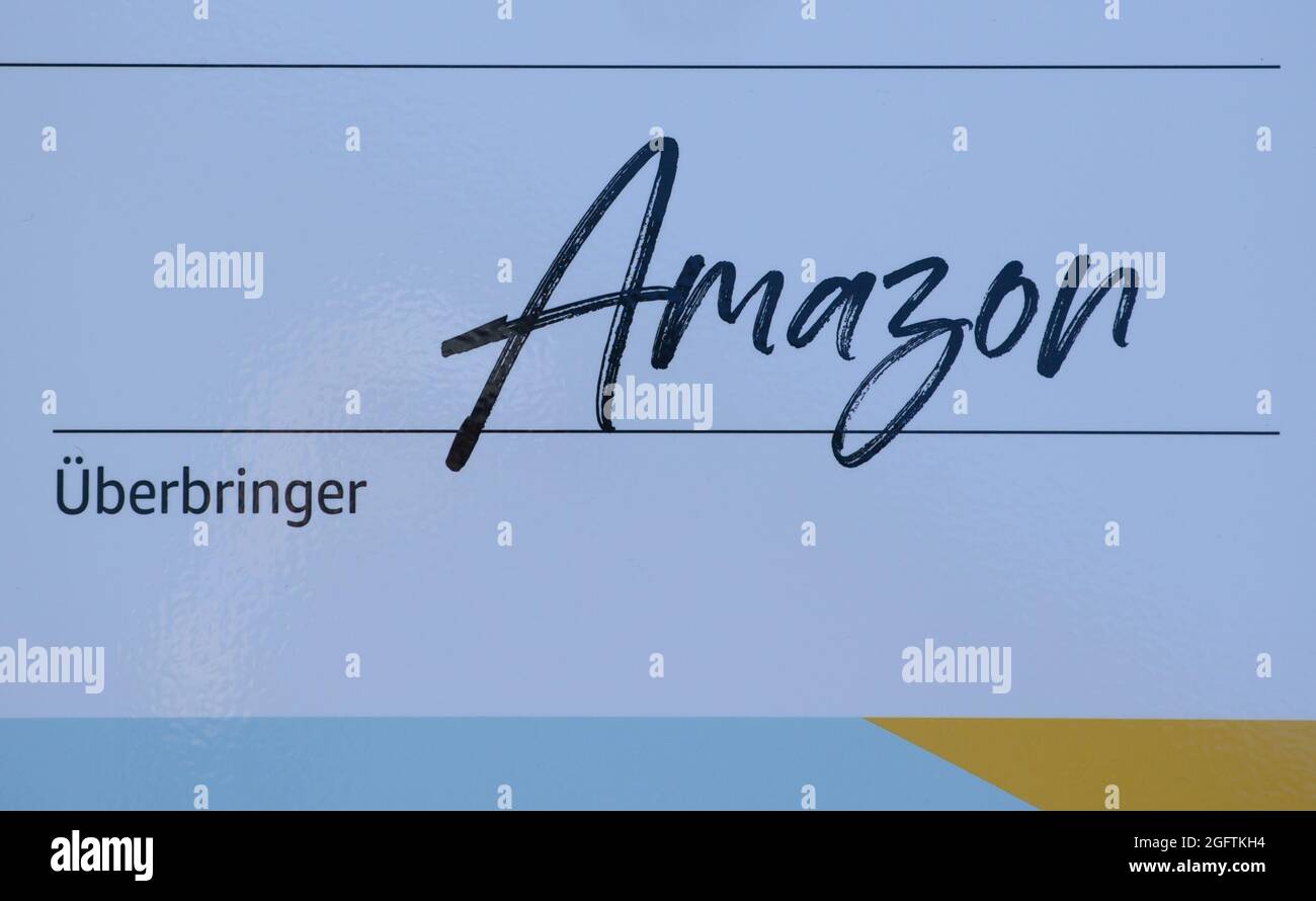 Dresda, Germania. 25 ago 2021. La parola Amazon come firma è scritta su un  assegno oversize all'apertura del Centro di sviluppo Amazon di Dresda. La  società online Amazon ha aperto oggi il