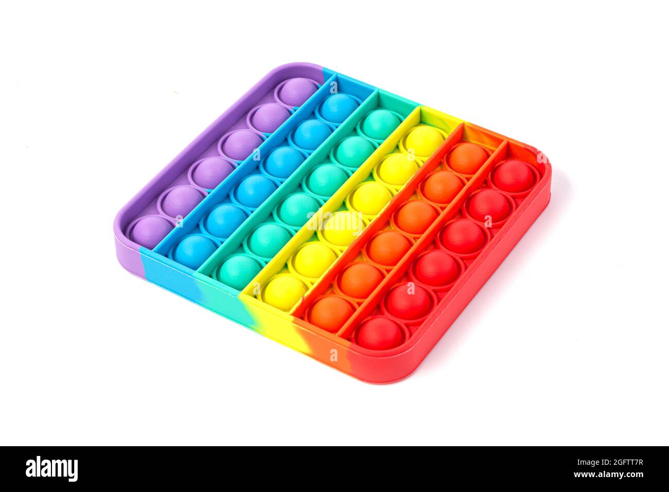 Pop IT Simple Dimple - silicone sensoriale anti-stress Fidget giocattolo colorato arcobaleno gioco isolato su sfondo bianco, spazio copia. Foto Stock