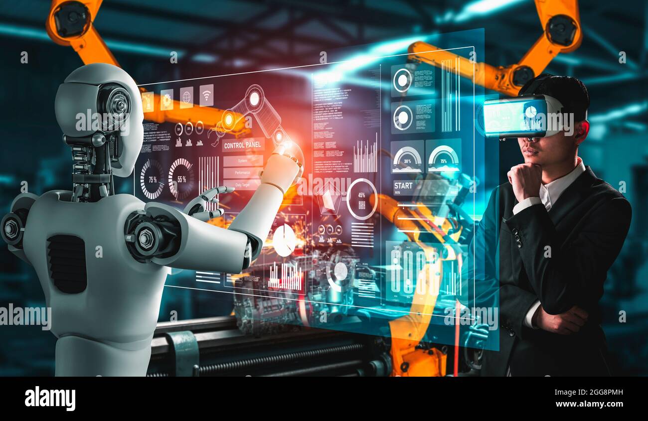 Robot industriale meccanizzato e lavoratore umano che lavorano insieme  nella futura fabbrica . Concetto di intelligenza artificiale per la  rivoluzione industriale e Foto stock - Alamy