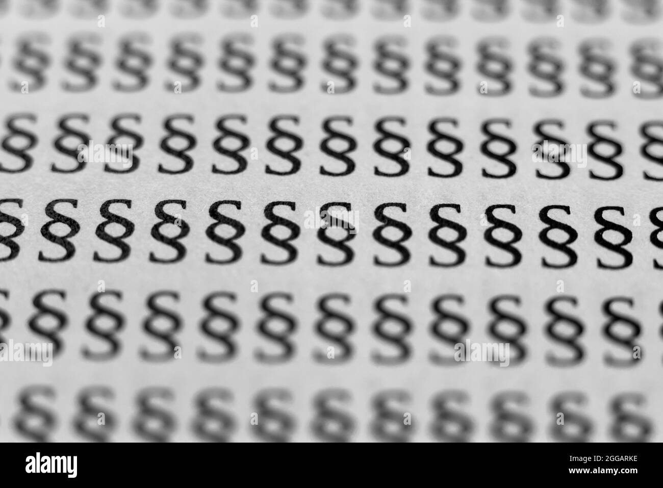 molti piccoli caratteri di paragrafo nero bokeh segno di legge Foto Stock