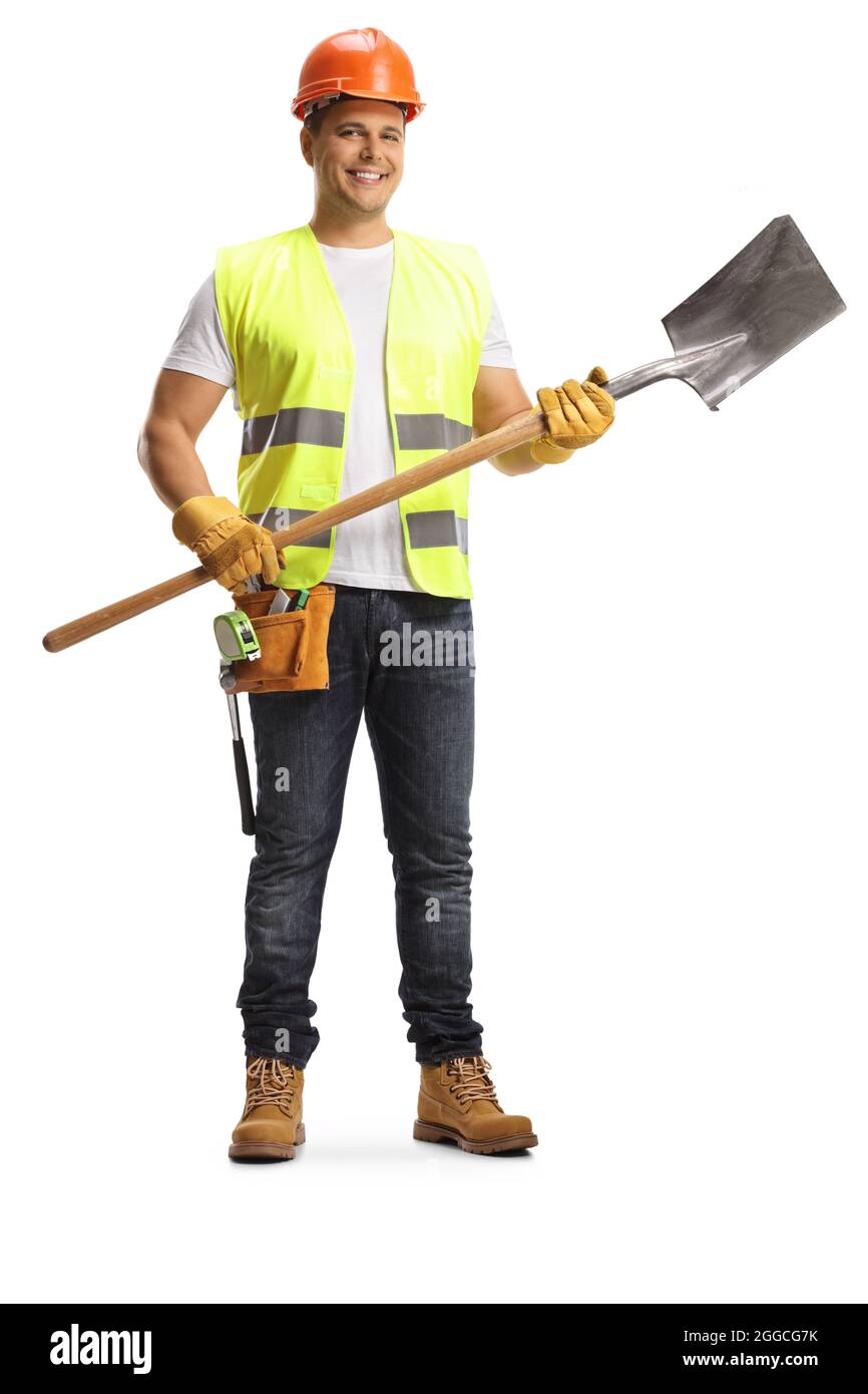 Ritratto a tutta lunghezza di un operaio che tiene una pala isolata su sfondo bianco Foto Stock