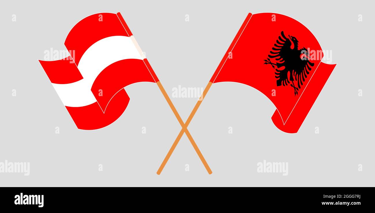 Bandiere incrociate e sventolanti dell'Albania e dell'Austria Illustrazione Vettoriale