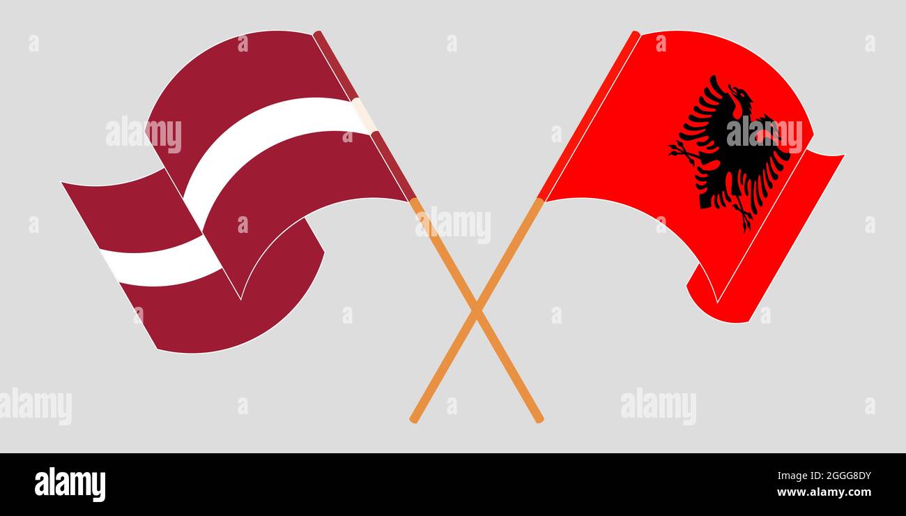 Bandiere incrociate e sventolanti dell'Albania e della Lettonia Illustrazione Vettoriale