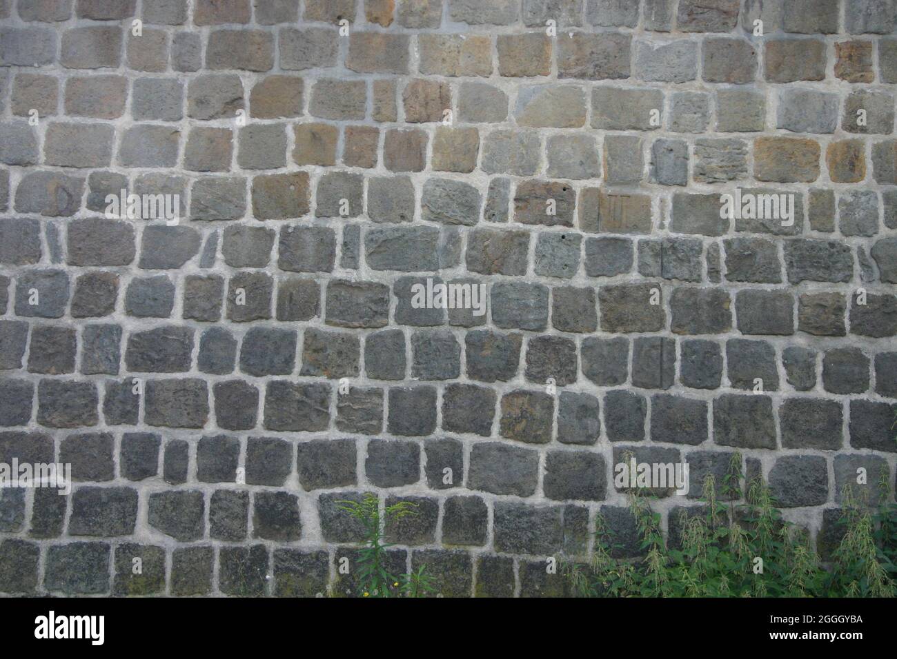 Hintergrundbild Nahaufnahme einer Mauer aus Natursteine Foto Stock