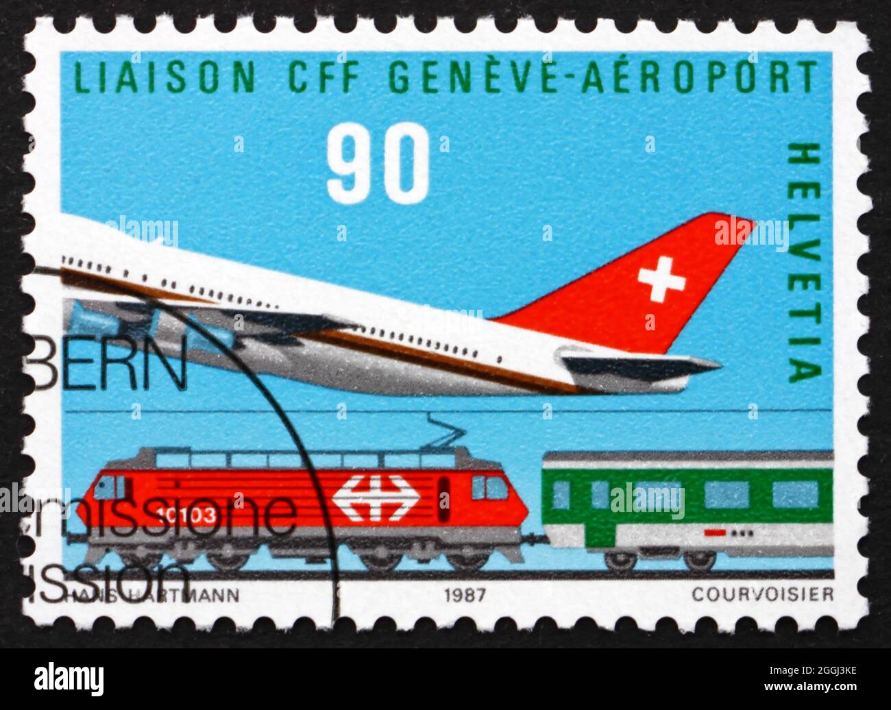 SVIZZERA - CIRCA 1987: Un francobollo stampato in Svizzera mostra aereo e treno, aeroporto Cointrin-Ginevra, apertura del collegamento ferroviario, circa 1987 Foto Stock