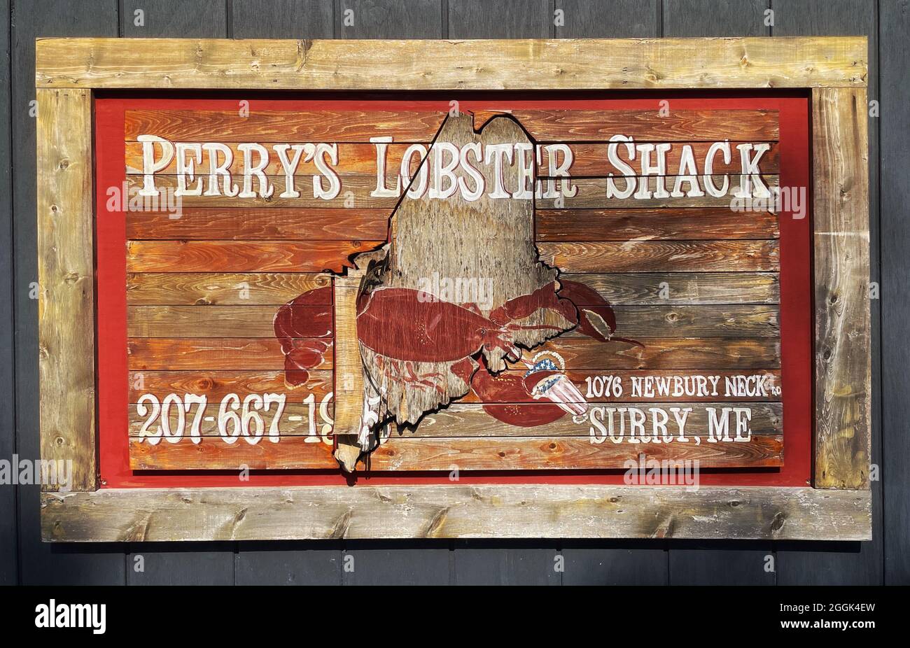 Cartello in legno per il tempo Perry’s Lobster Shack è un baracca a basso contenuto d’acqua che offre aragoste e piatti di pesce insieme a sostanziosi contorni e birre. Foto Stock