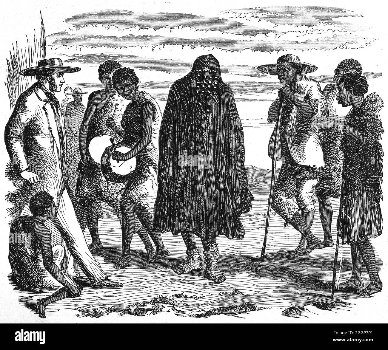 Uno sciamano africano e un arcobaleno nel loro costume rituale. Foto Stock