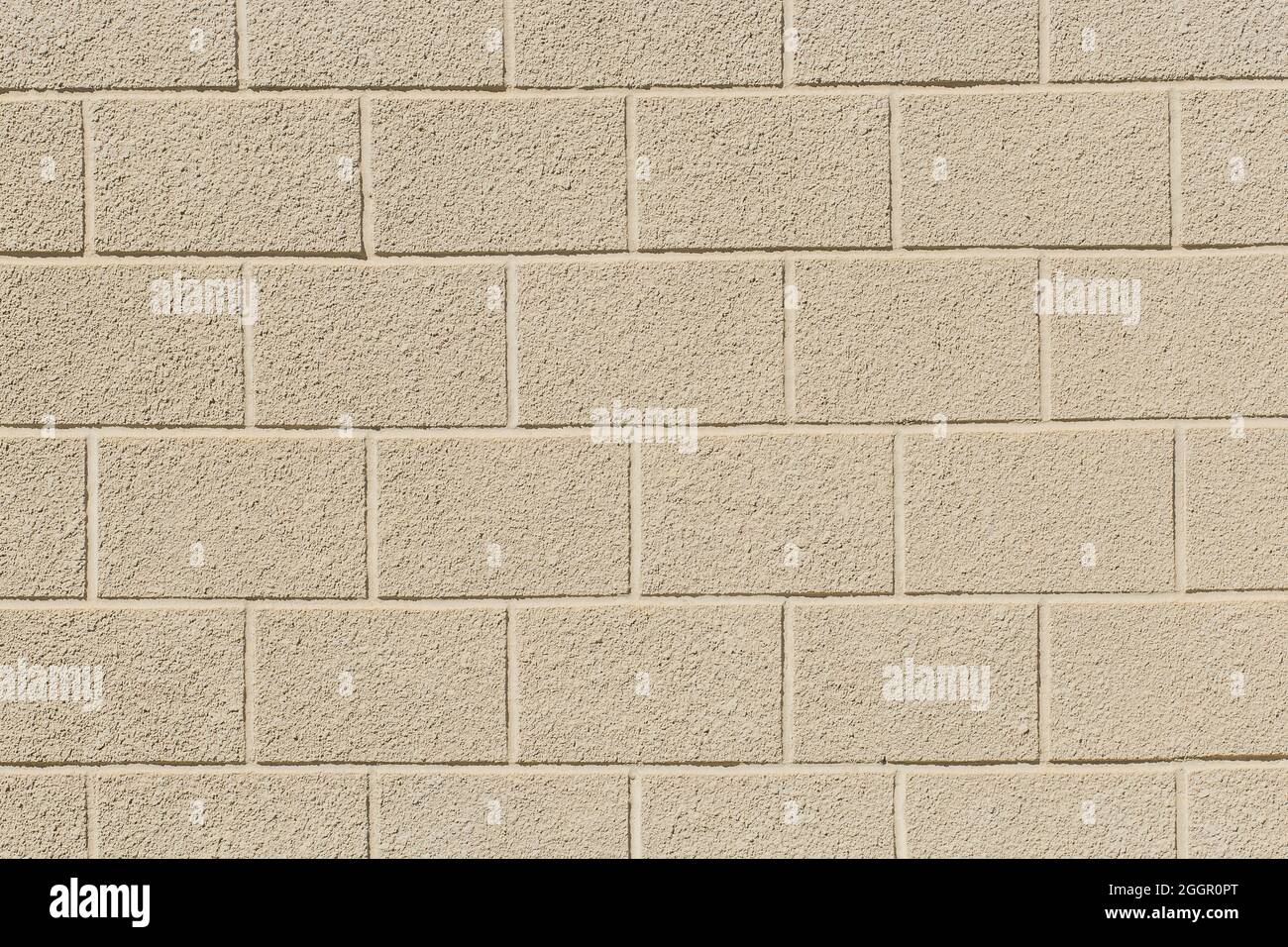 Sabbia sporco chiaro mattone blocco pietra motivo superficie parete texture sfondo. Foto Stock