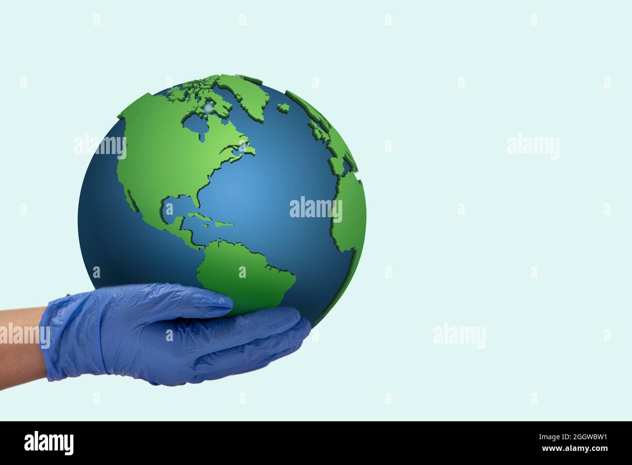 Mano umana che indossa guanti che tengono la Terra contro lo sfondo liscio. Foto Stock