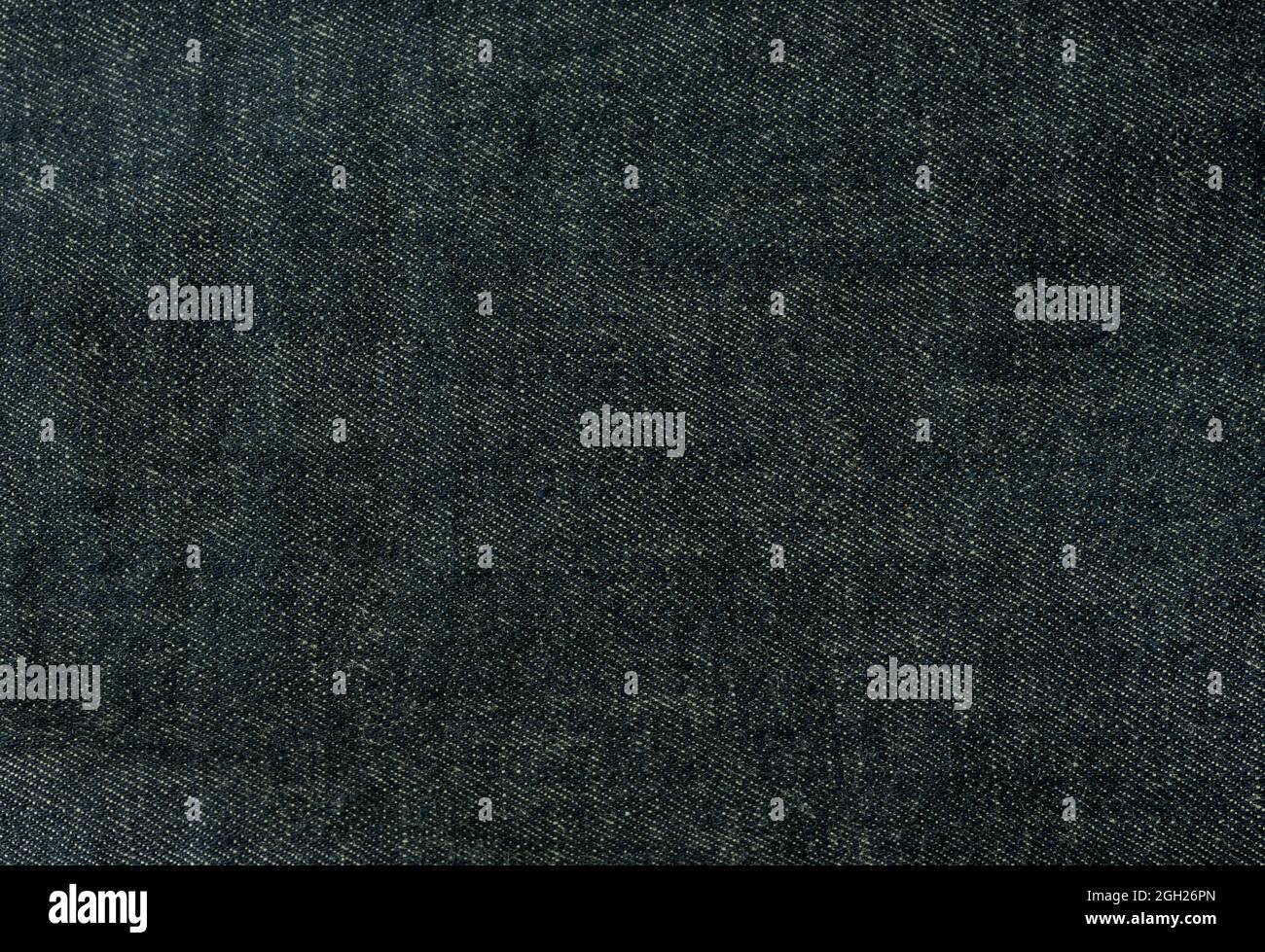 Texture in denim per il design, sfondo jeans in denim. Tessuto, tessuto. Foto Stock
